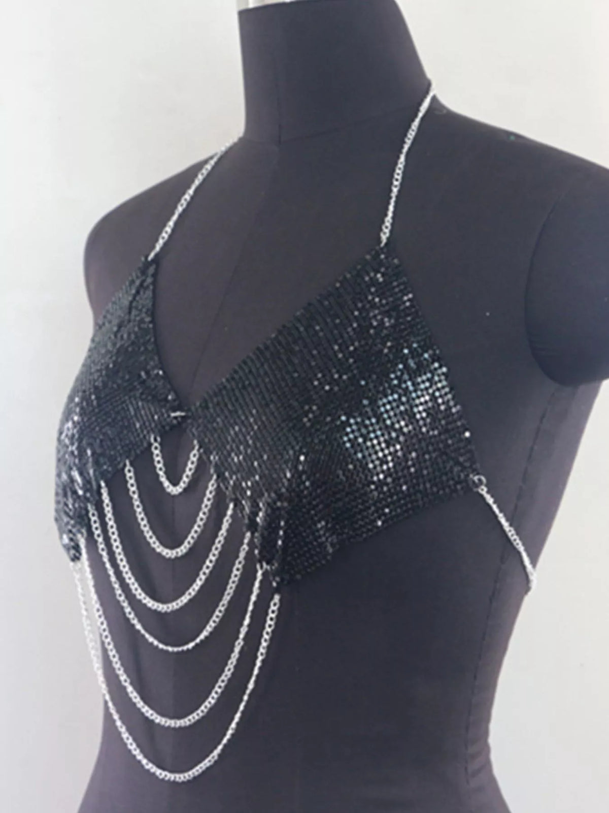 Black chainmail halter cami top with silver chain drapes, side angle on mannequin