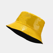 Bright yellow bucket hat with black underside, shown at an angle