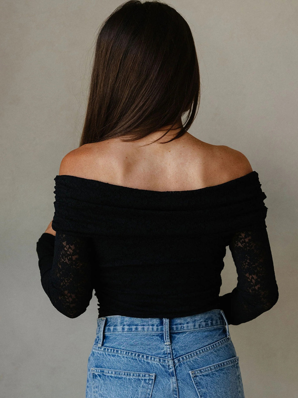 Back view showing wide off-shoulder neckline