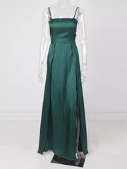 Full-length view of green high-slit spaghetti-strap maxi dress on a clear form