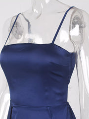 Close-up of blue maxi dress bodice and thin spaghetti straps on a clear form