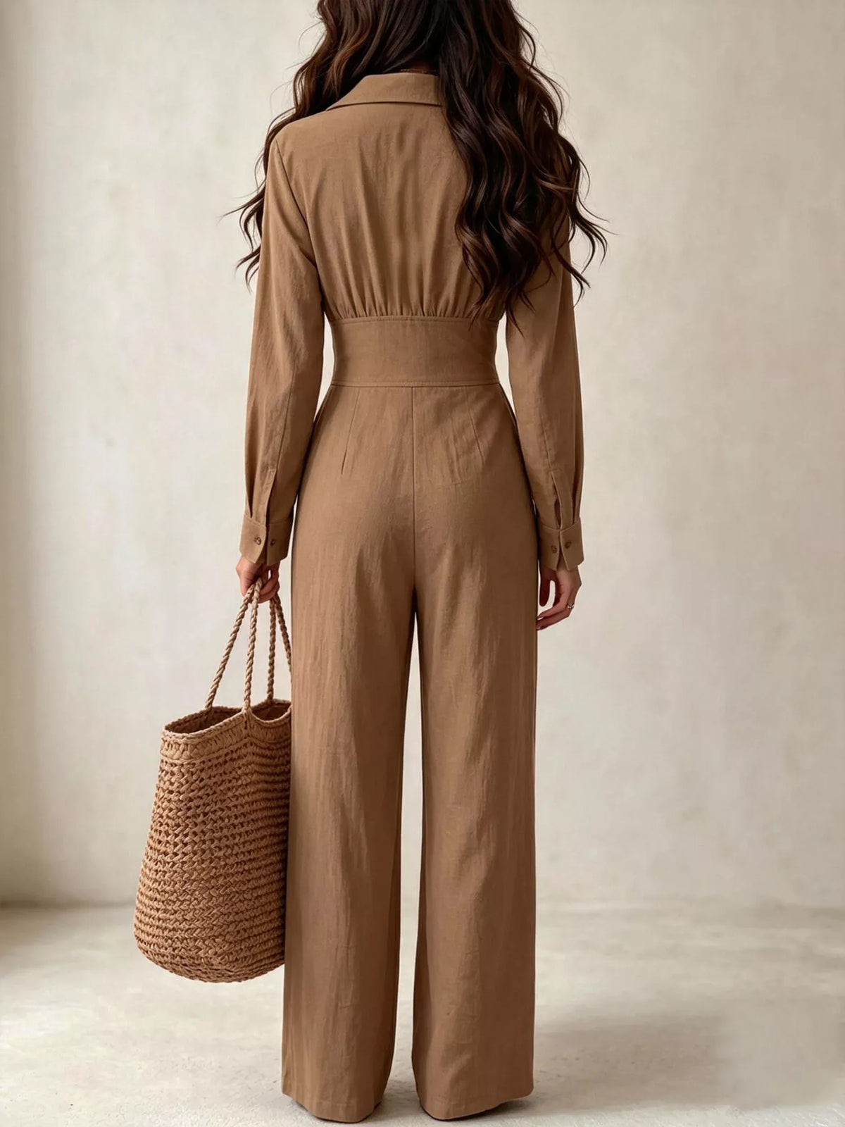 Close view of beige jumpsuit lapel collar and button front