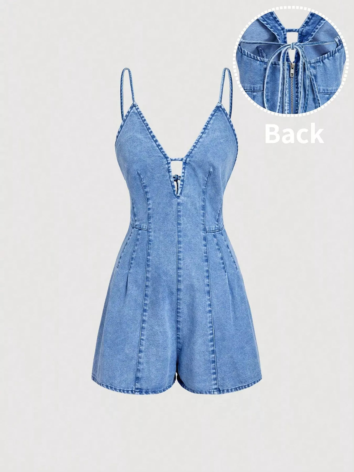 Front view of light-wash denim romper with spaghetti straps and deep V neckline
