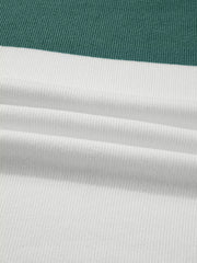 Close-up of teal and ivory rib-knit fabric