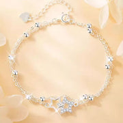 Silver star bracelet arranged in a circle with sparkling star charms