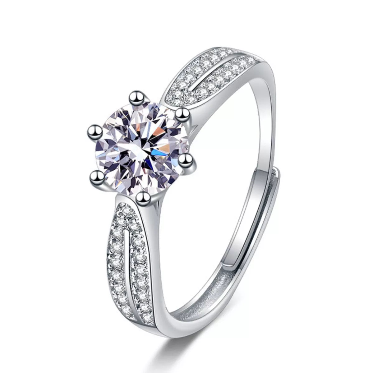 Silver moissanite solitaire-style ring with pavé split shoulders on a white background
