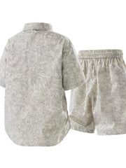 Back view of light neutral printed shirt and matching shorts