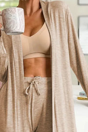 Front view of model wearing tan open-front cardigan with matching lounge pants