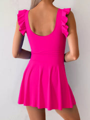 Bright pink ruffle-sleeve swim dress shown from the back