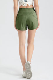 Back view of dark green shorts showing curved rear panel seam