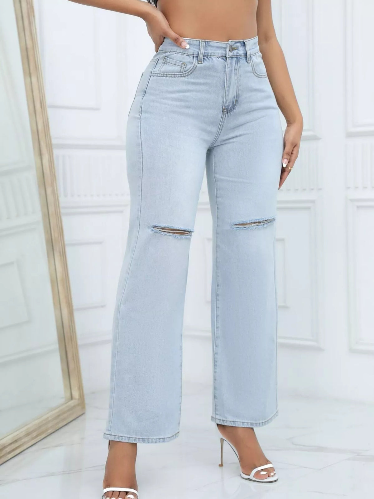 Back view of light-wash wide-leg jeans with rear pockets