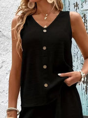 Closer front view of the black set showing the button placket and relaxed fit.