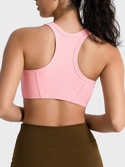 Pink cropped tank showing wide racerback straps