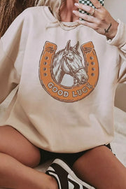 Close view of horse and good luck horseshoe chest graphic
