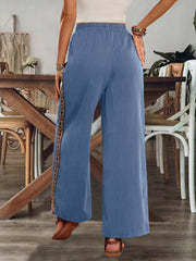 Blue pants showing elastic waist and wide legs