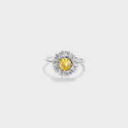 Silver-tone sunflower ring with a yellow center stone on white