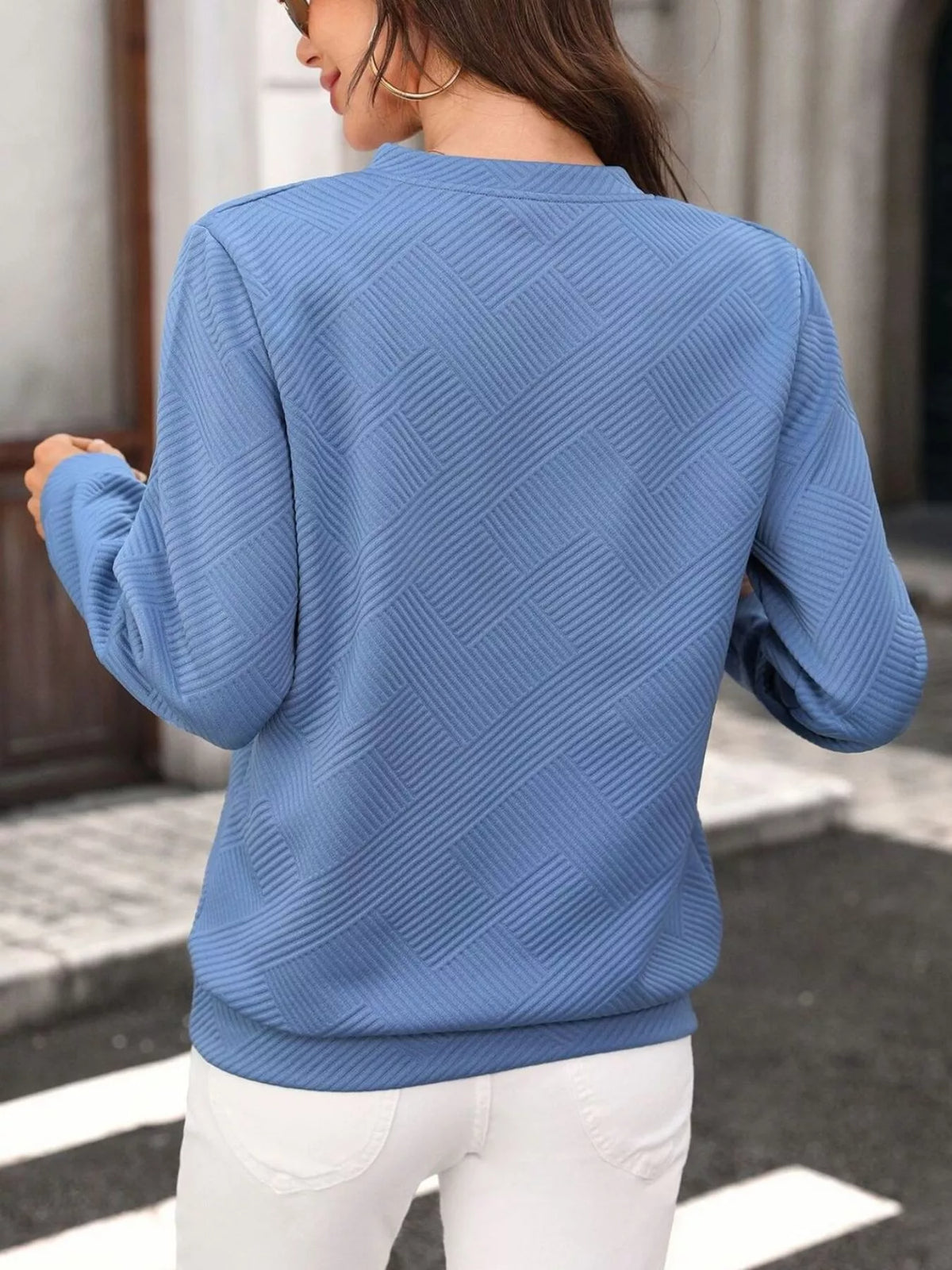 Side view showing the sweatshirt fit
