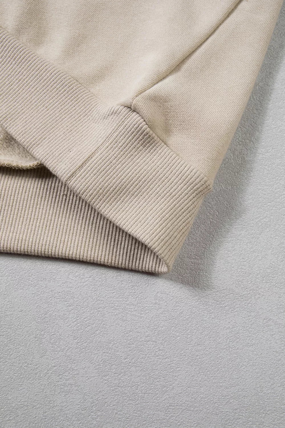 Close view of sleeve seam and cuff construction