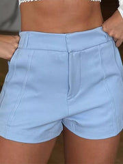 Close front view of light-blue shorts showing waistband and pockets