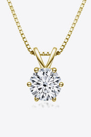 Round clear-stone solitaire pendant on a gold-tone chain against white