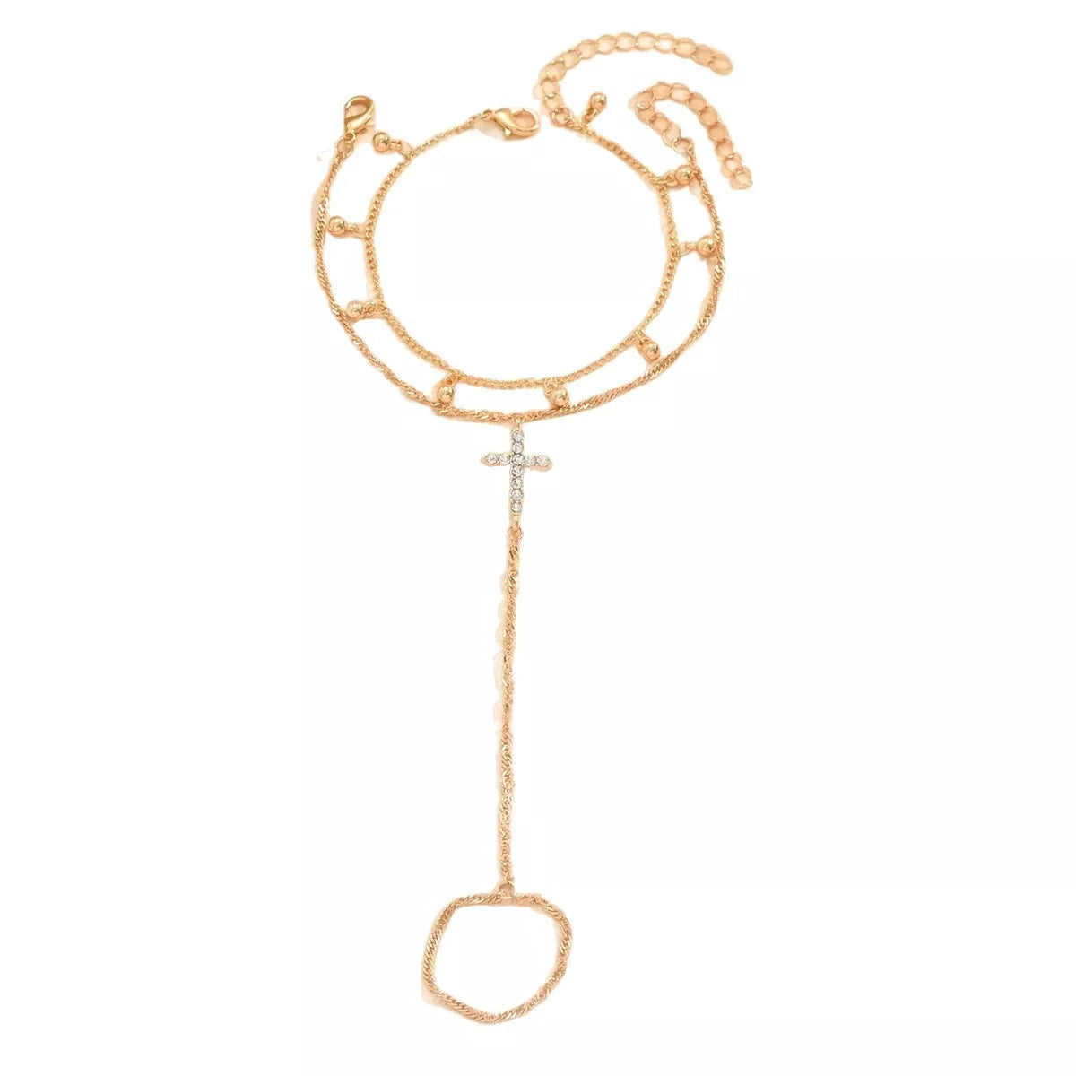 Gold-tone chain bracelet with rhinestone cross charm shown flat