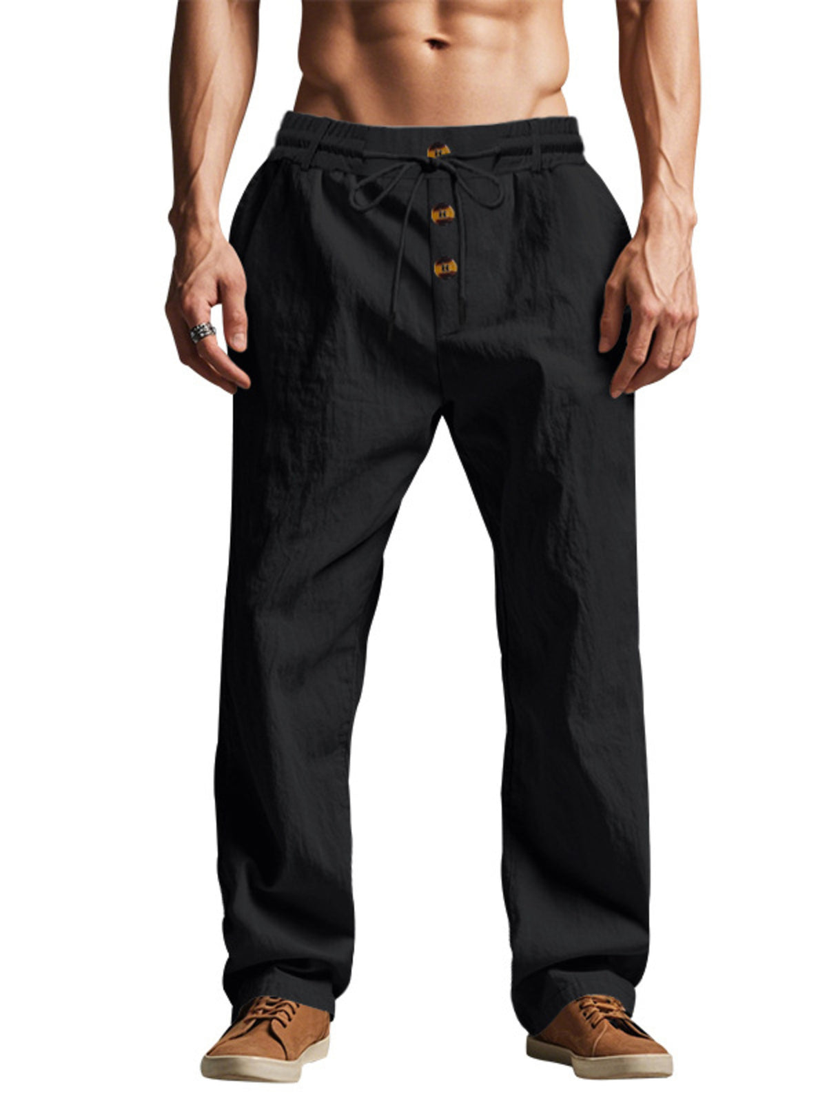 Front view of black drawstring pants with button front and wide legs