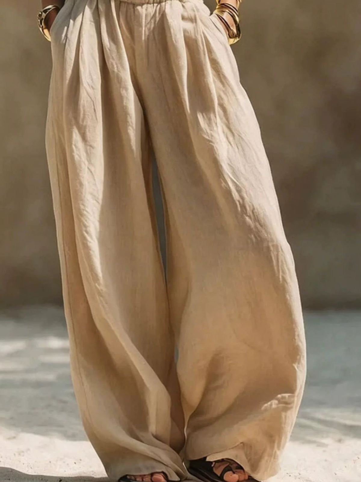 Cream wide-leg pants with elastic waist shown on model