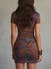 Back view of the fitted paisley mini dress