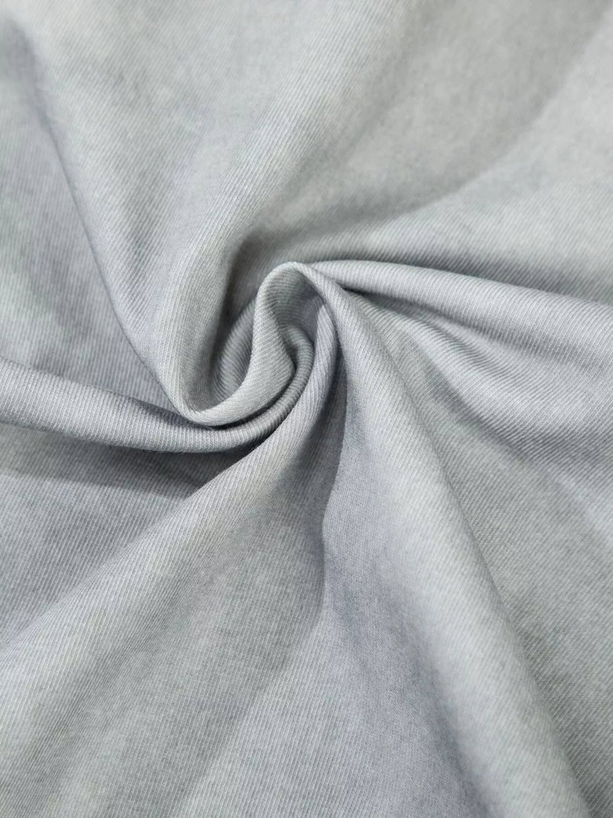 Close-up of gray washed knit fabric with soft cloudy finish