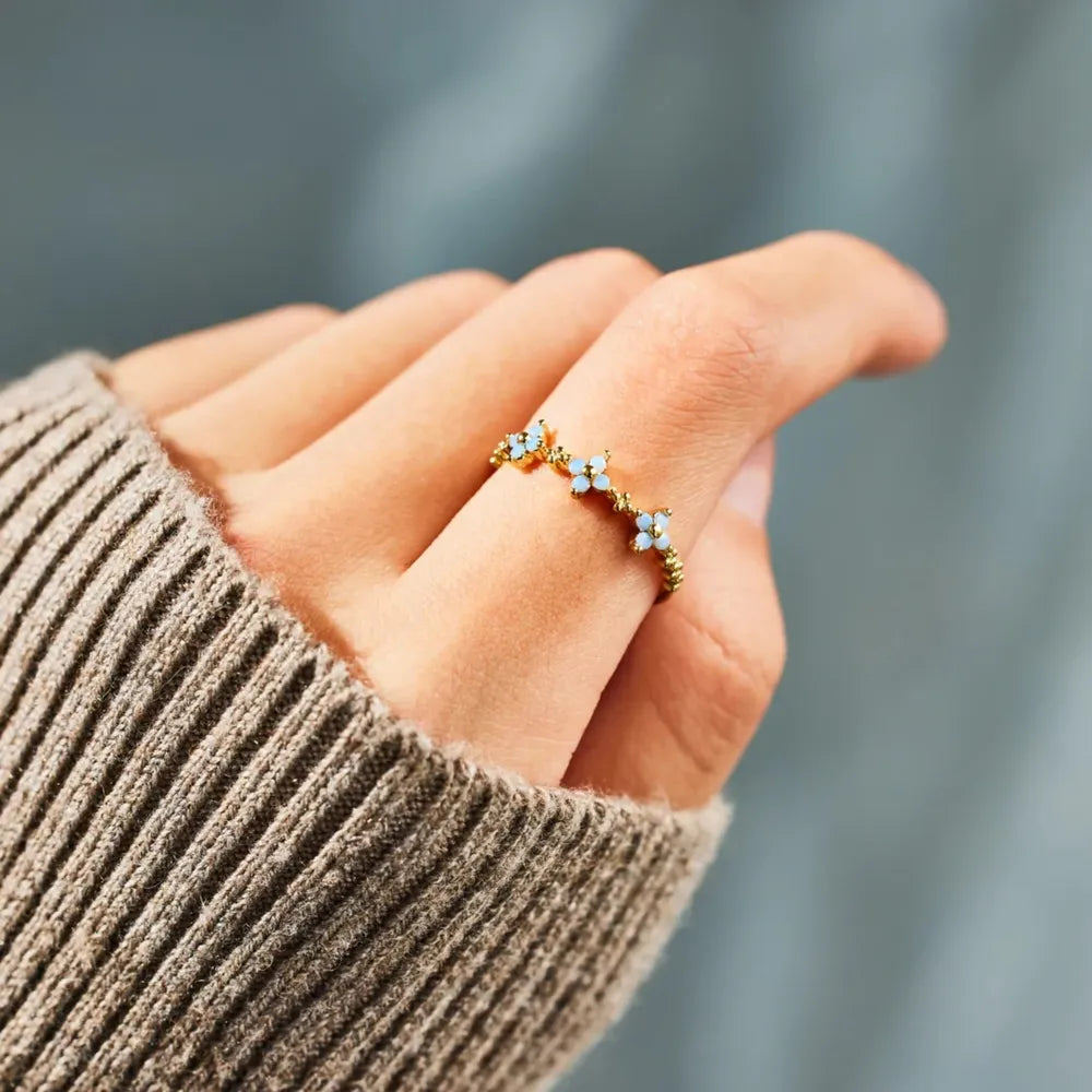 Close view of the flower ring worn on a hand