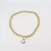 Chunky pearl chain necklace and heart pendant laid flat