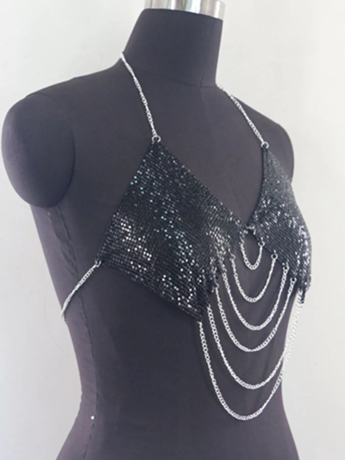 Black chainmail halter cami top with silver chain fringe, angled front view on mannequin