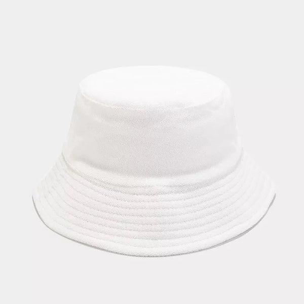 White and light purple wide-brim bucket hats shown from the front