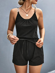 Black scoop-neck romper with decorative shoulder rings