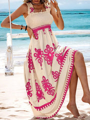 Close view of pink floral pattern on flowing maxi dress