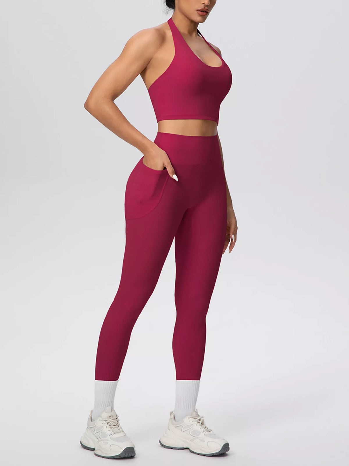Front view of burgundy halter-neck crop top and leggings