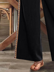 Close view of black side stripe and hem