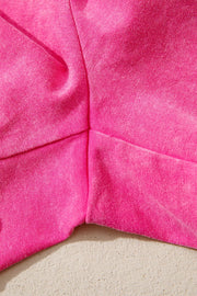 Close-up of pink shorts fabric and stitched seams
