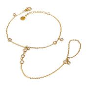 Close view of gold chain and clear stones