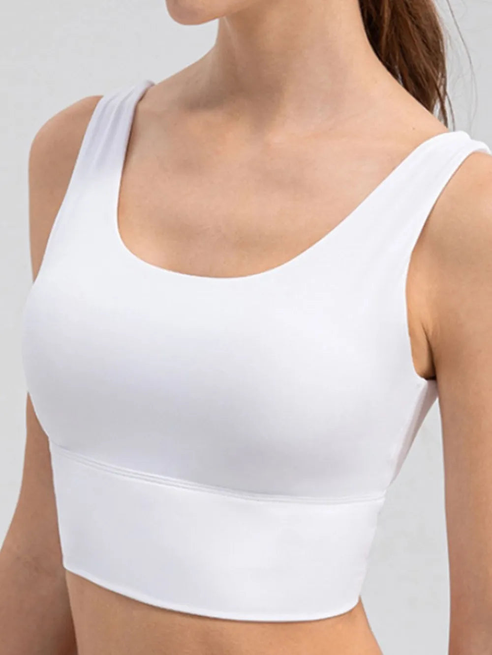 White cropped tank showing its V-shaped back neckline