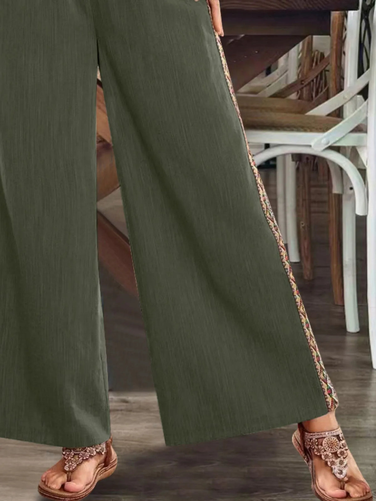 Close view of olive side stripe and hem