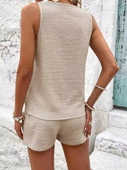 Back view of the beige tank and matching shorts.