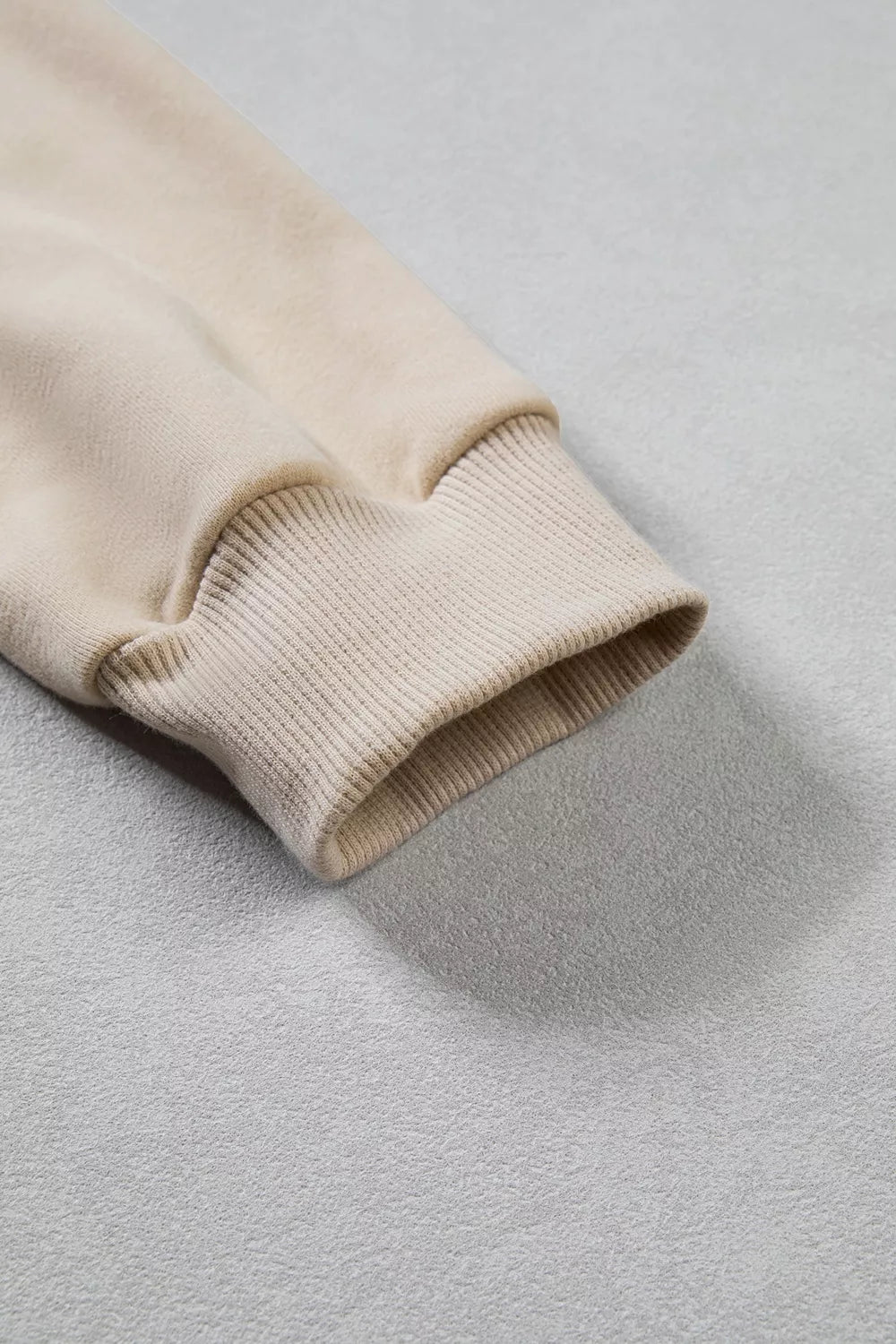 Detail of ribbed sleeve cuff and fabric