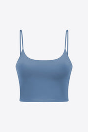 Blue scoop-neck sports cami with thin straps, shown flat on white.