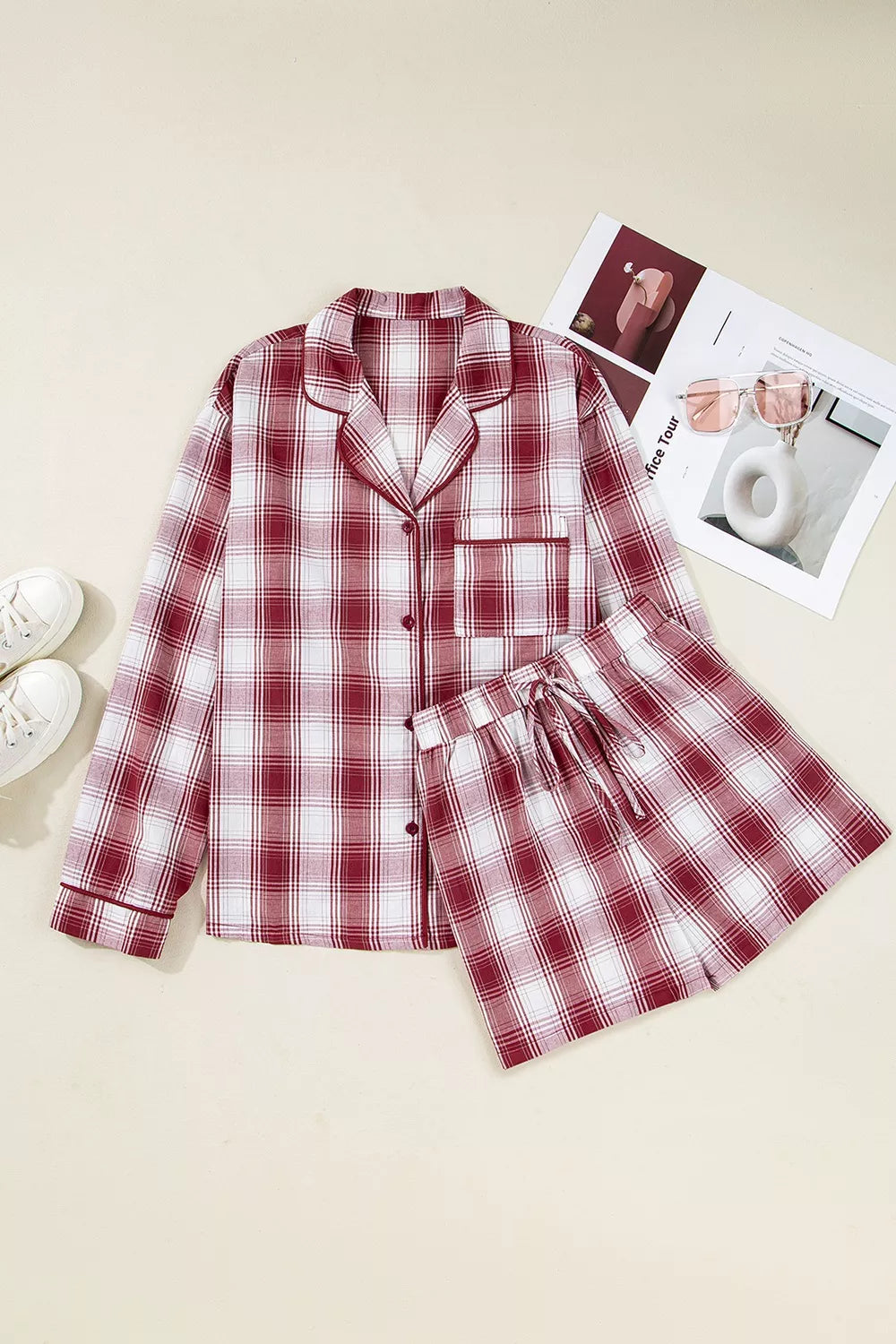 Red plaid pajama shirt and drawstring shorts laid flat