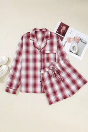 Red plaid pajama shirt and drawstring shorts laid flat