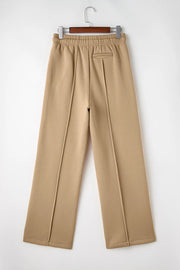 Back product view of tan wide-leg trousers with elastic waistband.