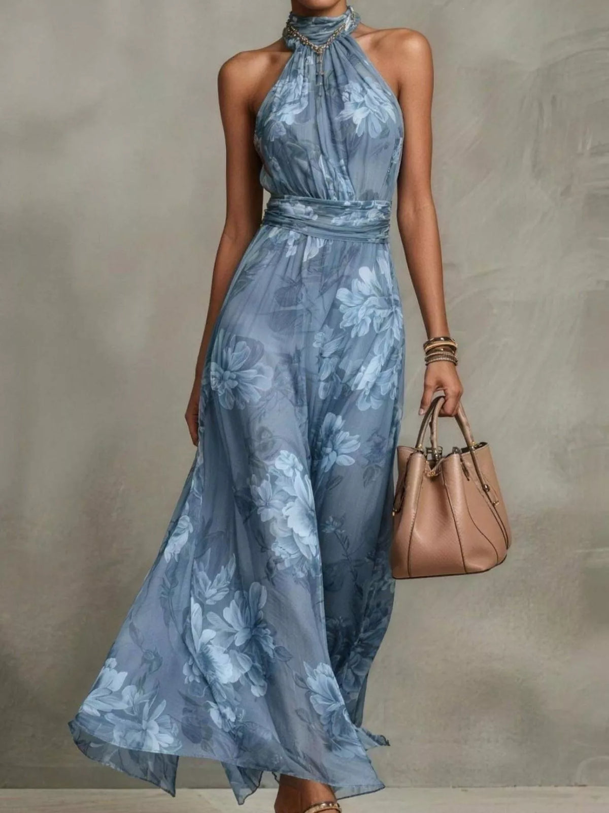 Model wearing a blue floral sleeveless tiered maxi dress, full length.