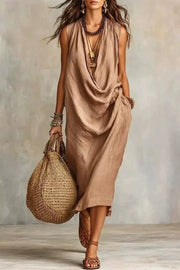 Tan sleeveless midi dress with draped neckline and side pockets, full-length view