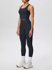 Black scoop-neck tank and high-waisted leggings, front view